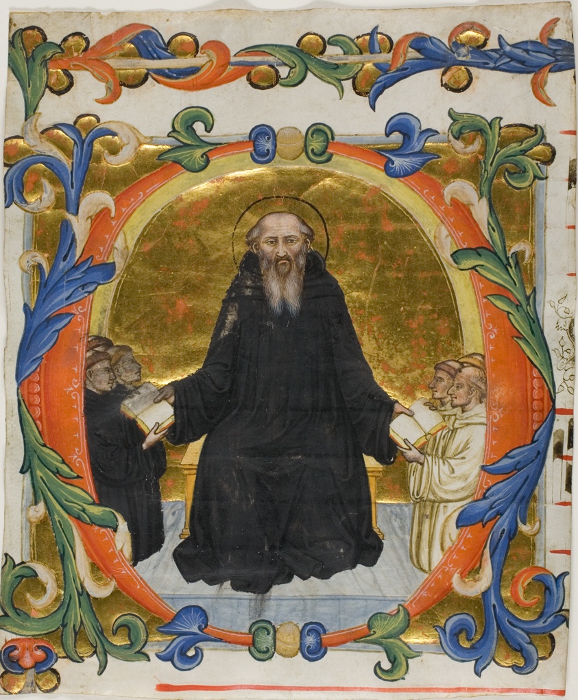 A large, red-orange letter O decorated with gold leaf and blue, orange, and green vine-like flourishes contains within it a balding man with a gray beard in a black robe. He holds out a book in each hand. To his left are a group of kneeling men in black robes. Men in white robes kneel at his right.