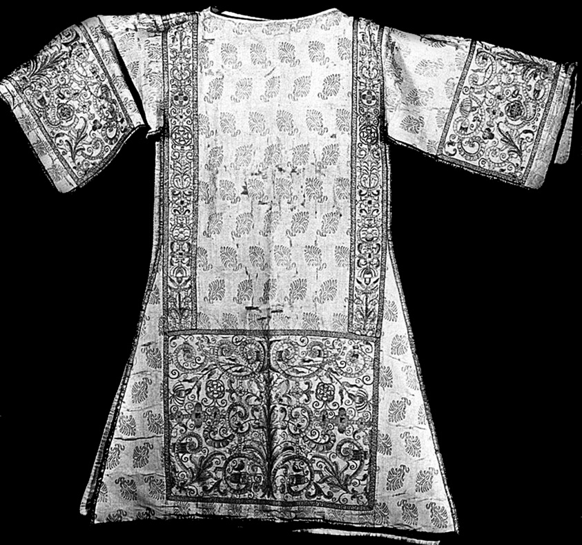 A tunic with broad arms and a floral and paisley design throughout.