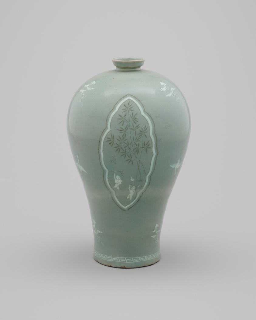 Pale green vase decorated with clouds, cranes, and children playing near bamboo trees.