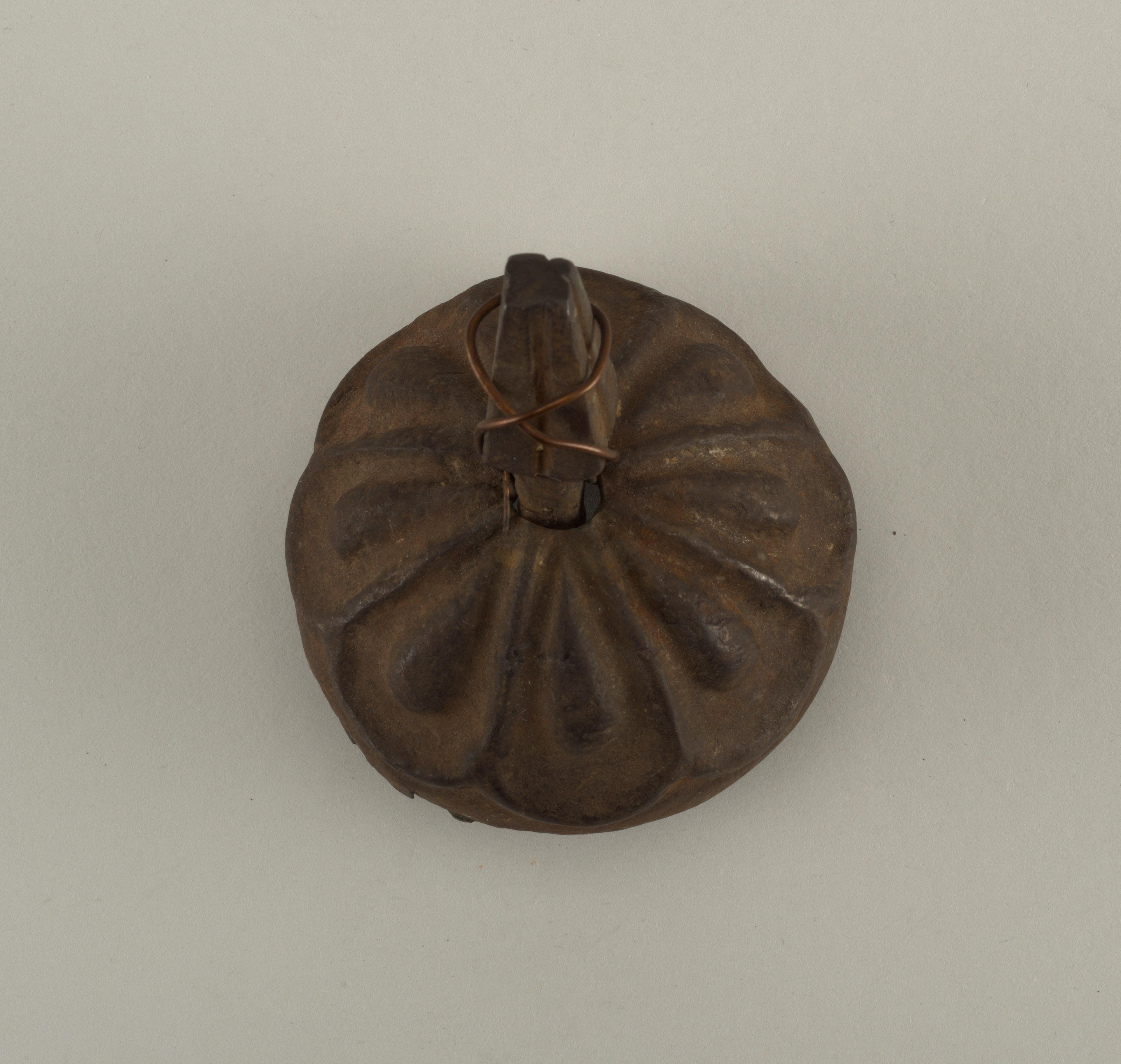 Decorative door boss and nail — Decorative door boss and nail. Wrought iron.