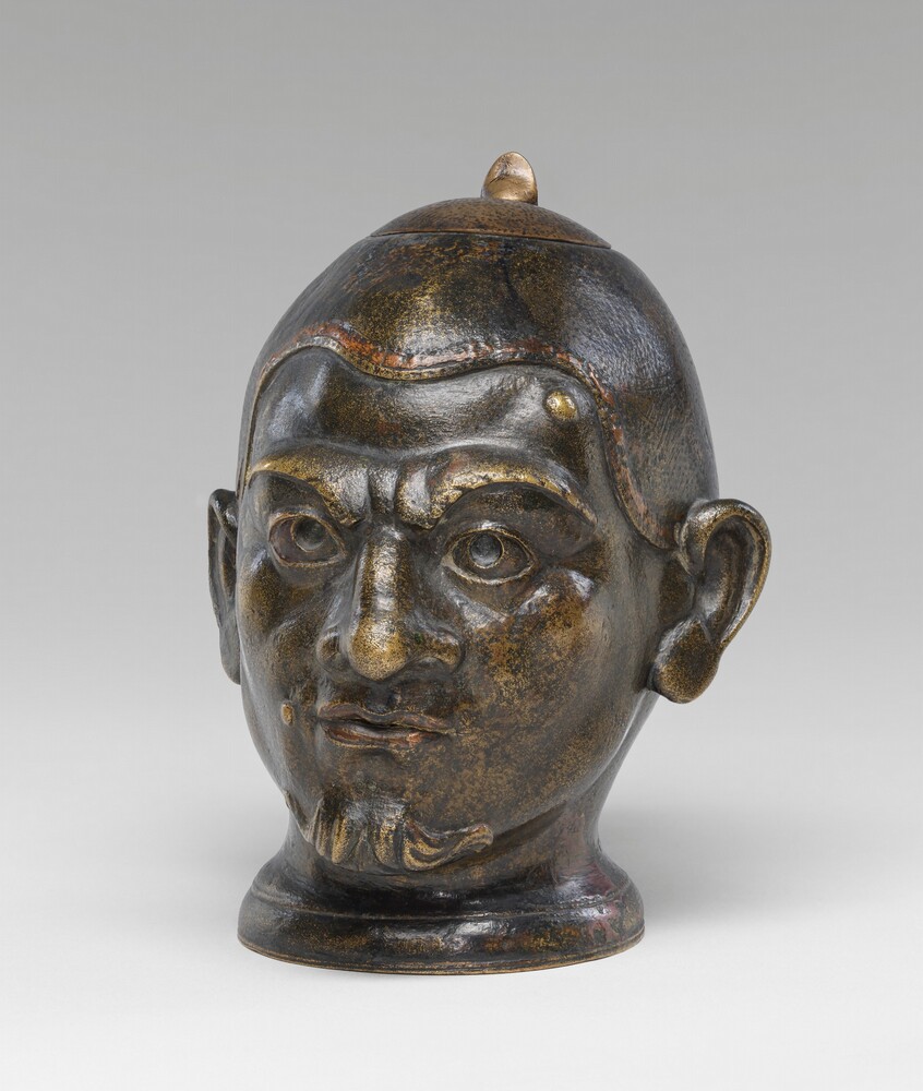 Inkwell in the Form of a Grotesque Head — Decorative Art by Probably French 19th Century (imitator of Roman, 2nd/3rd Century). copper alloy with glass insert.